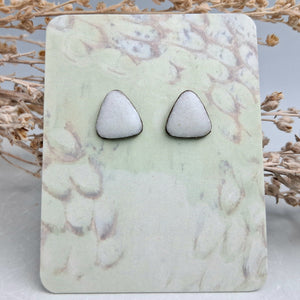 White triangle studs