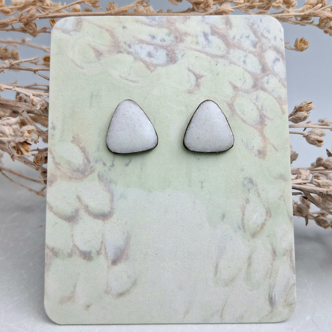 White triangle studs