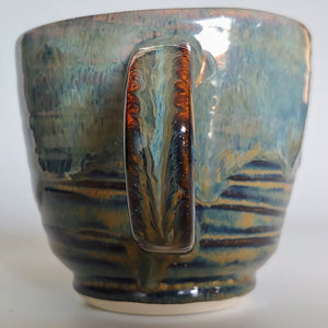 Mug -flowing river rock