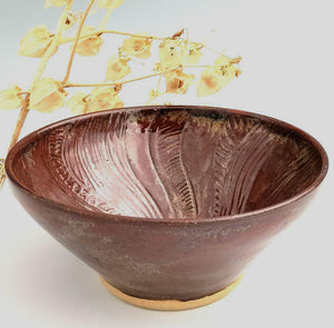 Red bowl with spiral sun