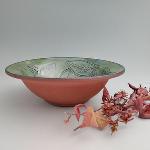 Leafy green bowl, red clay