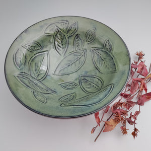 Leafy green bowl, red clay